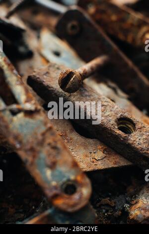 Scrap metal. Rusty screws, latches, curtain. Rust texture. Close-up. Macro. Corrosion of metal Stock Photo