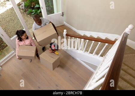 Couple and their daughter arriving in their new home Stock Photo
