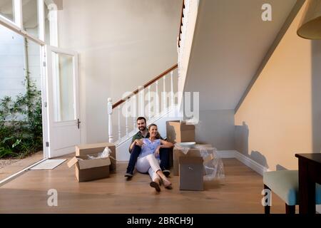 Caucasian couple arriving at their new home Stock Photo