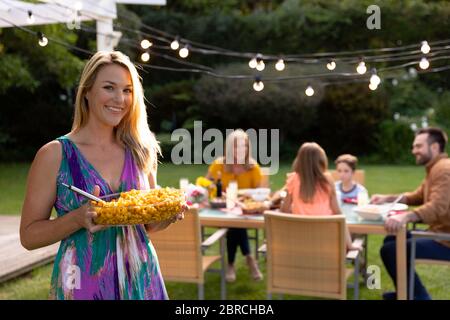 Caucasian family at home in their garden Stock Photo