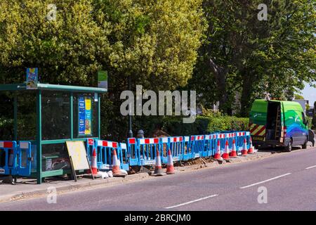 SSE Enterprise Contracting van and worker with pavement cordoned off at Bournemouth, Dorset UK in May - Mercedes-Benz Sprinter van Stock Photo