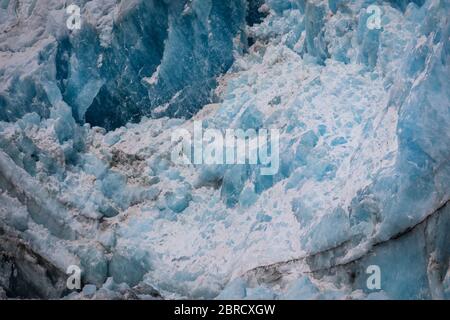 Sawyer Glacier, Tracy Arm Fjord, Southeast Alaska, is an active tidewater glacier appreciated by tourists on small ship cruises and boat tours. Stock Photo