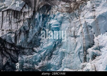 Sawyer Glacier, Tracy Arm Fjord, Southeast Alaska, is an active tidewater glacier appreciated by tourists on small ship cruises and boat tours. Stock Photo