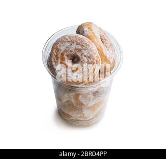 Mini  ring doughnuts in plastic glass isolated in white Stock Photo