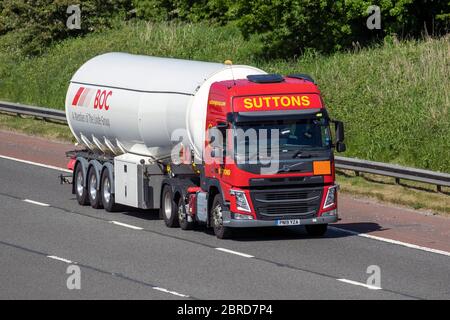 Suttons articulated Haulage delivery trucks, BOC gases lorry trailer, transportation, Linde Group truck, cargo carrier, Volvo vehicle, European commercial transport, industry, M6 at Manchester, UK Stock Photo