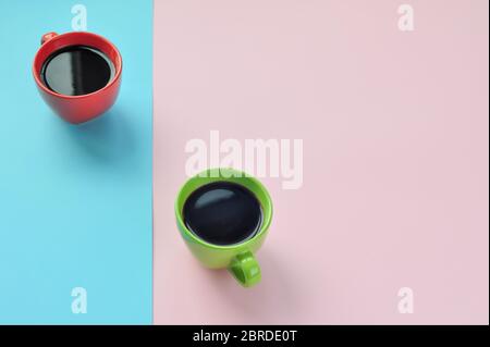 Americano in the different cups on the pink background. Flat Lay, cheerful day concept. This image could be used to show coffee break time or morning Stock Photo