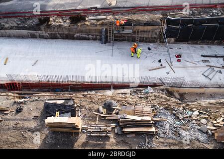 Aerial view of group of workers on construction site, working. Stock Photo