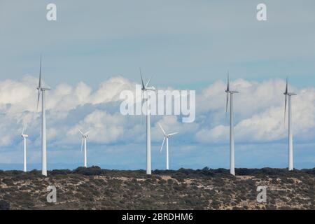 Old wind turbines on the hills of Caragueyes and Paterra, against a background of clouds on a February day, near Borja, Zaragoza province. Stock Photo