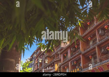 Feng Huang, China -  August 2019 : Close up of windows and balconies of old historic wooden Diaojiao houses it Feng huang Old Town Stock Photo