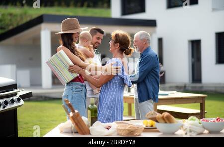 Portrait of happy people outdoors on family birthday party. Stock Photo