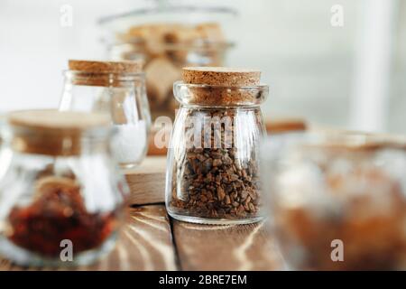 Glass jar of sweetener on wooden table Stock Photo