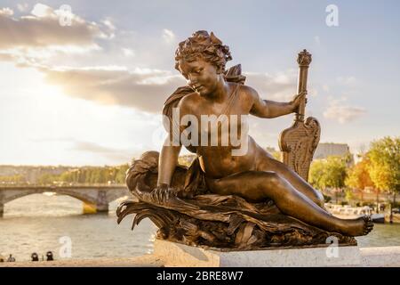 Statue of a nymph on the Pont Alexandre III in Paris, France. This bridge was named after russian Tsar Alexander III. Stock Photo