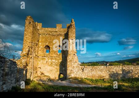 Ruins of the Genoese fortress in the city of Feodosia at sunset, Crimea, Russia Stock Photo