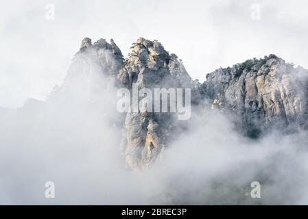 The Demerdji mountain with low lying clouds. Valley of ghosts. Landscape of Crimea, Russia. Stock Photo