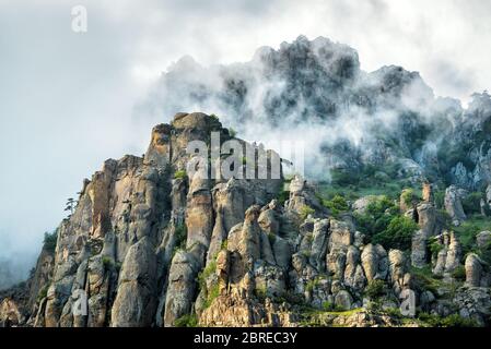 The Demerdji mountain with low lying clouds. Valley of ghosts. Landscape of Crimea, Russia. Stock Photo