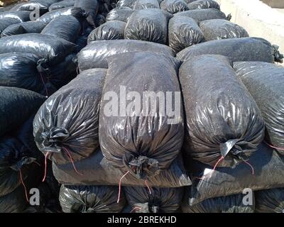 Packages with rubble and sand on the construction site. Building materials base. Stock Photo