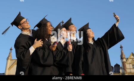 A group of multiethnic graduate students making selfie. Stock Photo