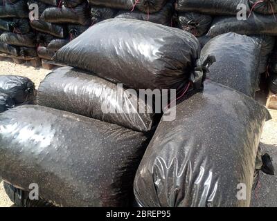 Packages with rubble and sand on the construction site. Building materials base. Stock Photo