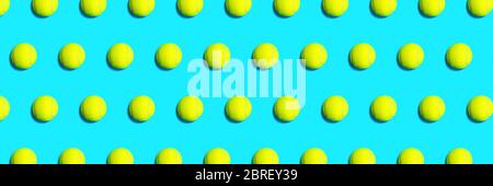Trendy pattern made of tennis ball on blue green mint background. Sport tennis layout. Flat lay. Stock Photo