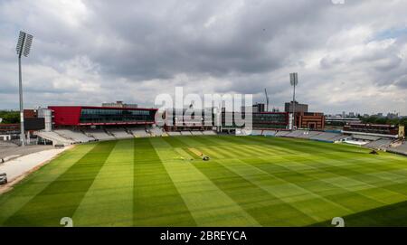 Groundsman David Shortt works on the pitch at Emirates Old Trafford, home of Lancashire CCC. Stock Photo