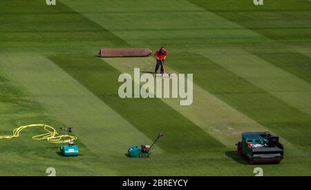 Groundsman David Shortt works on the pitch at Emirates Old Trafford, home of Lancashire CCC. Stock Photo