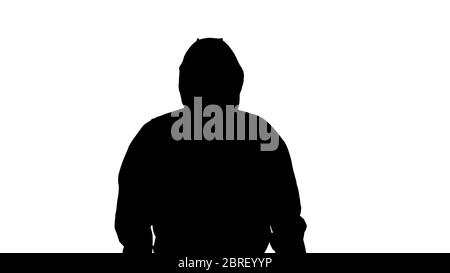 Silhouette Man wearing hazmat suit walking. Stock Photo