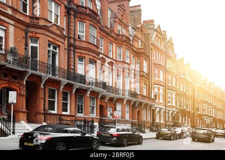 Brick row houses along Draycott Place and Cadogan Gardens near Cadogan Square in the affluent and exclusive neighborhood of Chelsea, London Stock Photo