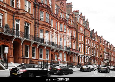 Brick row houses along Draycott Place and Cadogan Gardens near Cadogan Square in the affluent and exclusive neighborhood of Chelsea, London Stock Photo