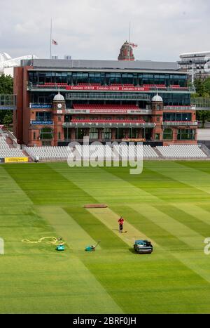 Groundsman David Shortt works on the pitch at Emirates Old Trafford, home of Lancashire CCC. Stock Photo