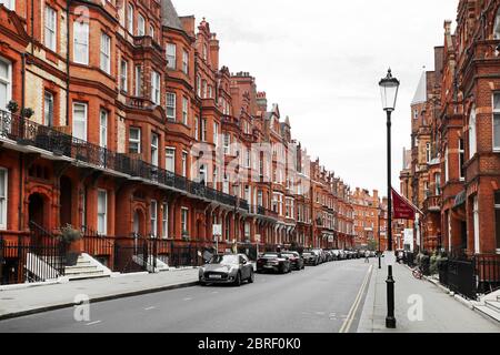 Brick row houses along Draycott Place and Cadogan Gardens near Cadogan Square in the affluent and exclusive neighborhood of Chelsea, London Stock Photo