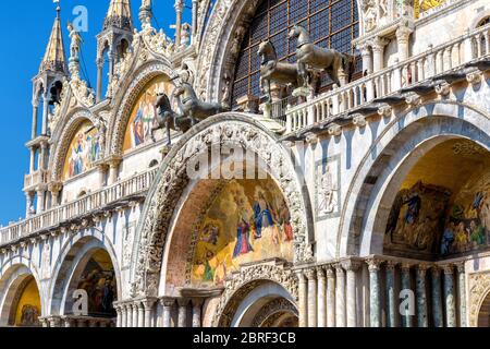 St Mark's Basilica (San Marco), Venice, Italy. It is a main tourist attraction of Venice. Renaissance facade of St Mark's Basilica close-up. Ornate ex Stock Photo