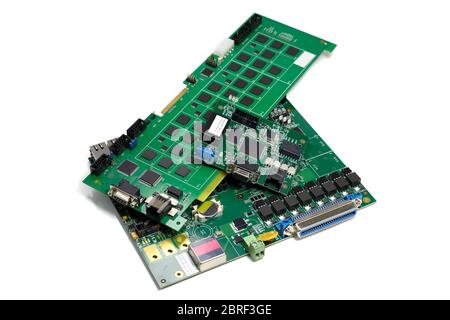 Set of electronic printed circuit boards with microchips and other components, angled view, isolated on white Stock Photo