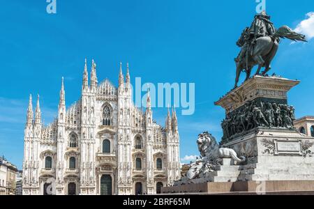 Milan Cathedral (Duomo di Milano) and monument to Victor Emmanuel II on Piazza del Duomo, Milan, Italy. Famous Milan Cathedral is the main landmark of Stock Photo