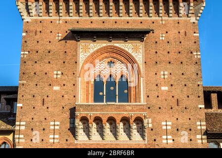 Sforza Castle close-up, Milan, Italy. It is a famous landmark of the city. Detail of main tower (Torre del Filarete). Ancient architecture in the Mila Stock Photo
