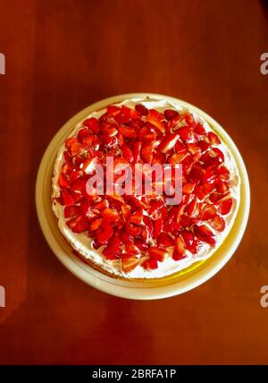 cream and strawberry cake with lemon sponge cake Stock Photo