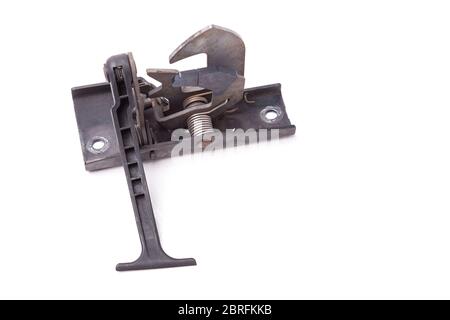 Metallic hood lock of a black car for replacement during body repair in a car workshop on a white isolated background in a photo studio. Equipment for Stock Photo