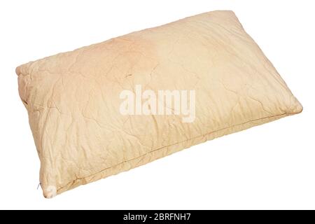 dirty used spotted pillow isolated on white background in diagonal composition Stock Photo
