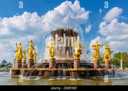 The Peoples Friendship Fountain in Exhibition of Achievements of National Economy (VDNKh). It was built in the 50s. 16 golden sculptures represent rep Stock Photo