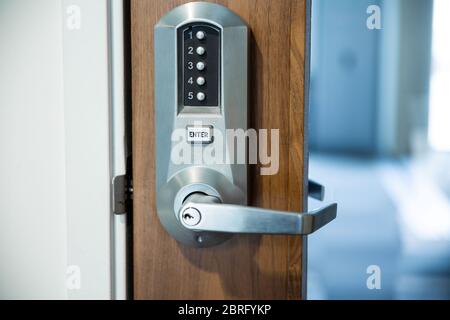 Digital smart door lock security system with a password, close up on numbers on the screenPass Code Door Handle Lock. Stock Photo