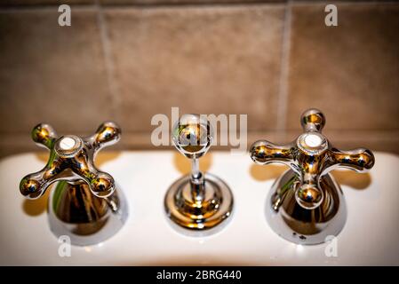antique art style bathroom sanitary taps in steel Stock Photo