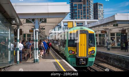 Southern Railway class 377 passenger train waiting for passengers to board at a railway station in London, England. Stock Photo