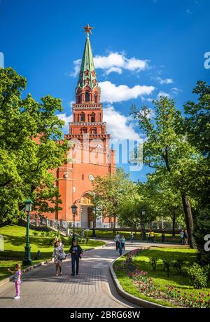 Moscow – May 19, 2019: Scenic view of Moscow Kremlin from Alexander Garden in summer, Russia. Moscow Kremlin is a top landmark of city. People walk ne Stock Photo