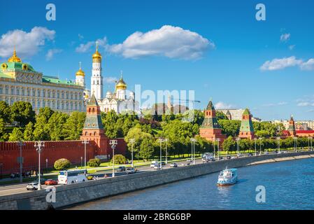 Moscow Kremlin in summer, Russia. Famous Moscow Kremlin is a top tourist attraction of city. Scenic view of the old Moscow landmark on embankment of M Stock Photo