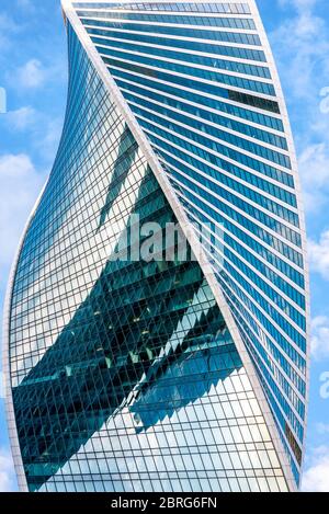 Moscow - Sep 10, 2017: Modern skyscraper in Moscow-City, Russia. Building with futuristic twisted design. Moscow-City is district with business and re Stock Photo