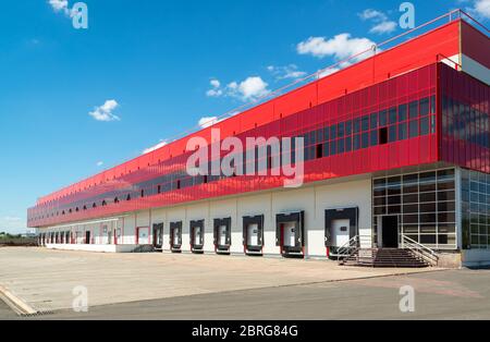 Modern warehouse on a background of blue sky Stock Photo