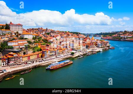 Douro river and local houses with orange roofs in Porto city aerial panoramic view. Porto is the second largest city in Portugal. Stock Photo