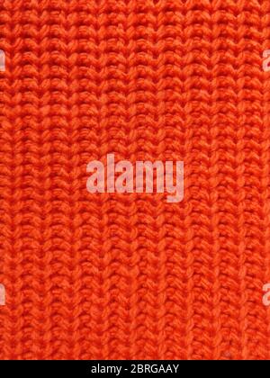 Pink knitted texture background. Pattern of wool knitting for wallpaper and an abstract background. Stock Photo