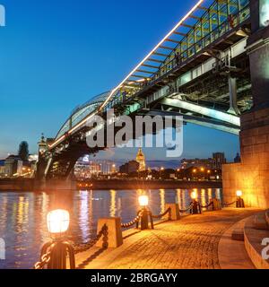 MOSCOW - AUGUST 20: Bogdan Khmelnitsky bridge at night on august 20, 2013 in Moscow. It is a beautiful pedestrian bridge across the Moscow River near Stock Photo