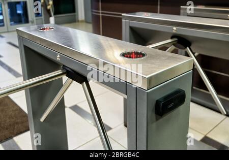 The tripod turnstile with electronic card reader iis closed Stock Photo