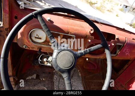 Rhyolite Ghost Town, Beatty Nevada - Rusted out antique automobile, interior. Stock Photo